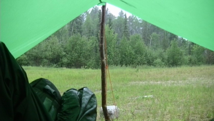 June 20- The view out of my tarp as I waited out a storm outside of the town of Ignace, Ontario. It was a deluge of rain but the tarp kept me dry. The folowing morning a black bear woke me up, sniffing around the outside of the tarp. Alas, I have found myself on an adventure!